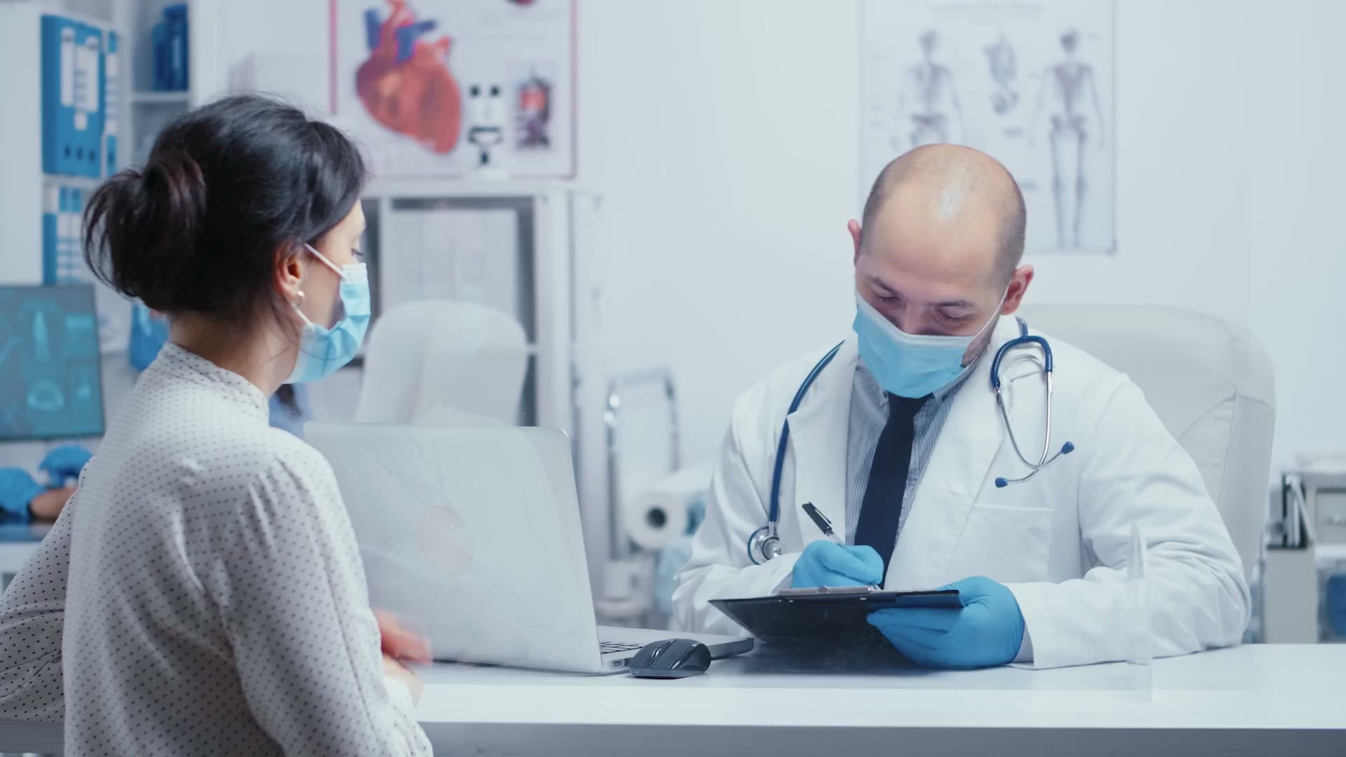 Physician consulting with a patient in a clinical setting
